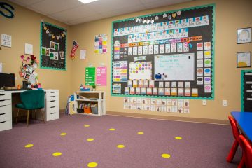 Preschool classroom with learning materials on wall