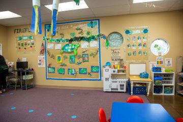 Preschool classroom with turtle themed artwork on wall